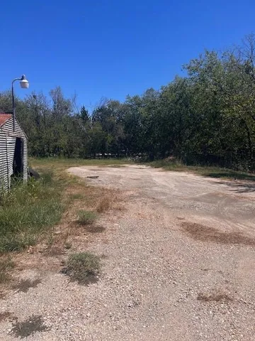 a view of open space with mountain view in back