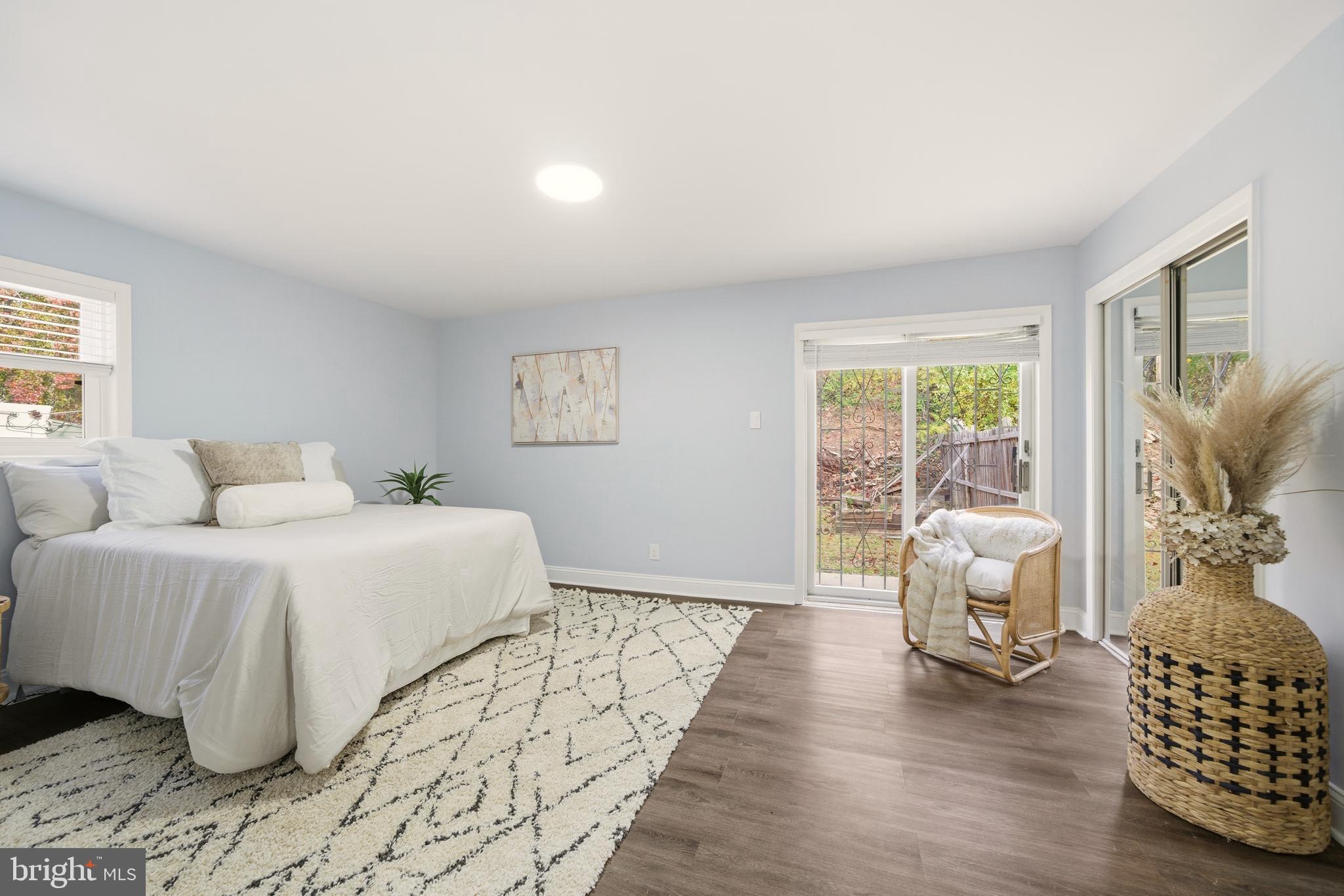 171 Juniper Road Havertown, PA 19083 - Photo 16 of 31 a bedroom with a bed and wooden floor