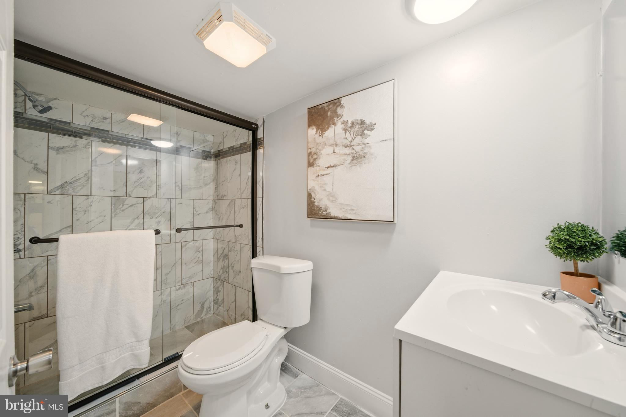 171 Juniper Road Havertown, PA 19083 - Photo 19 of 31 a white toilet sitting next to a bathroom sink