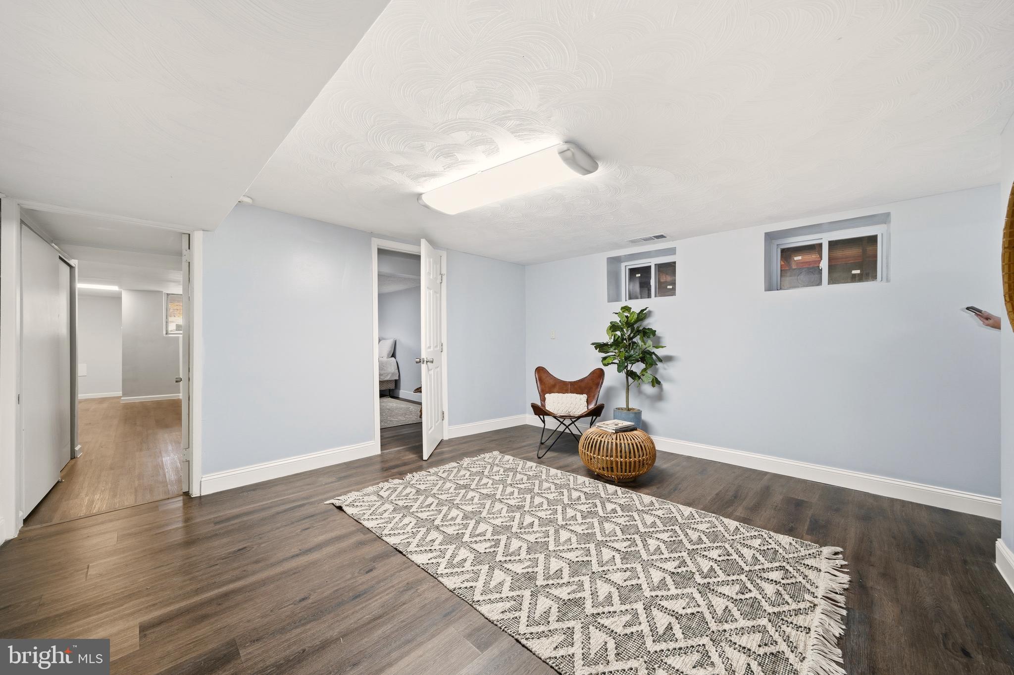 171 Juniper Road Havertown, PA 19083 - Photo 20 of 31 a bedroom with a bed and wooden floor