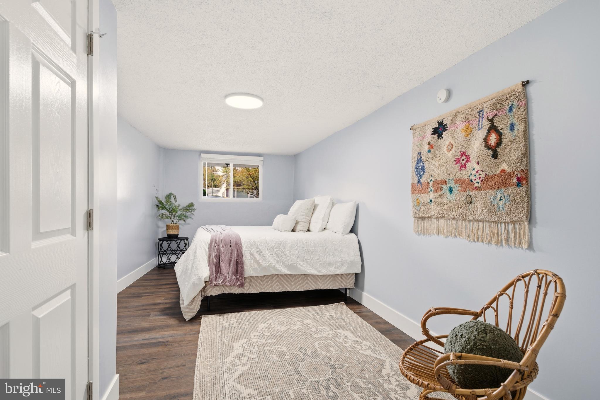 171 Juniper Road Havertown, PA 19083 - Photo 22 of 31 a bedroom with a bed and flowerpot