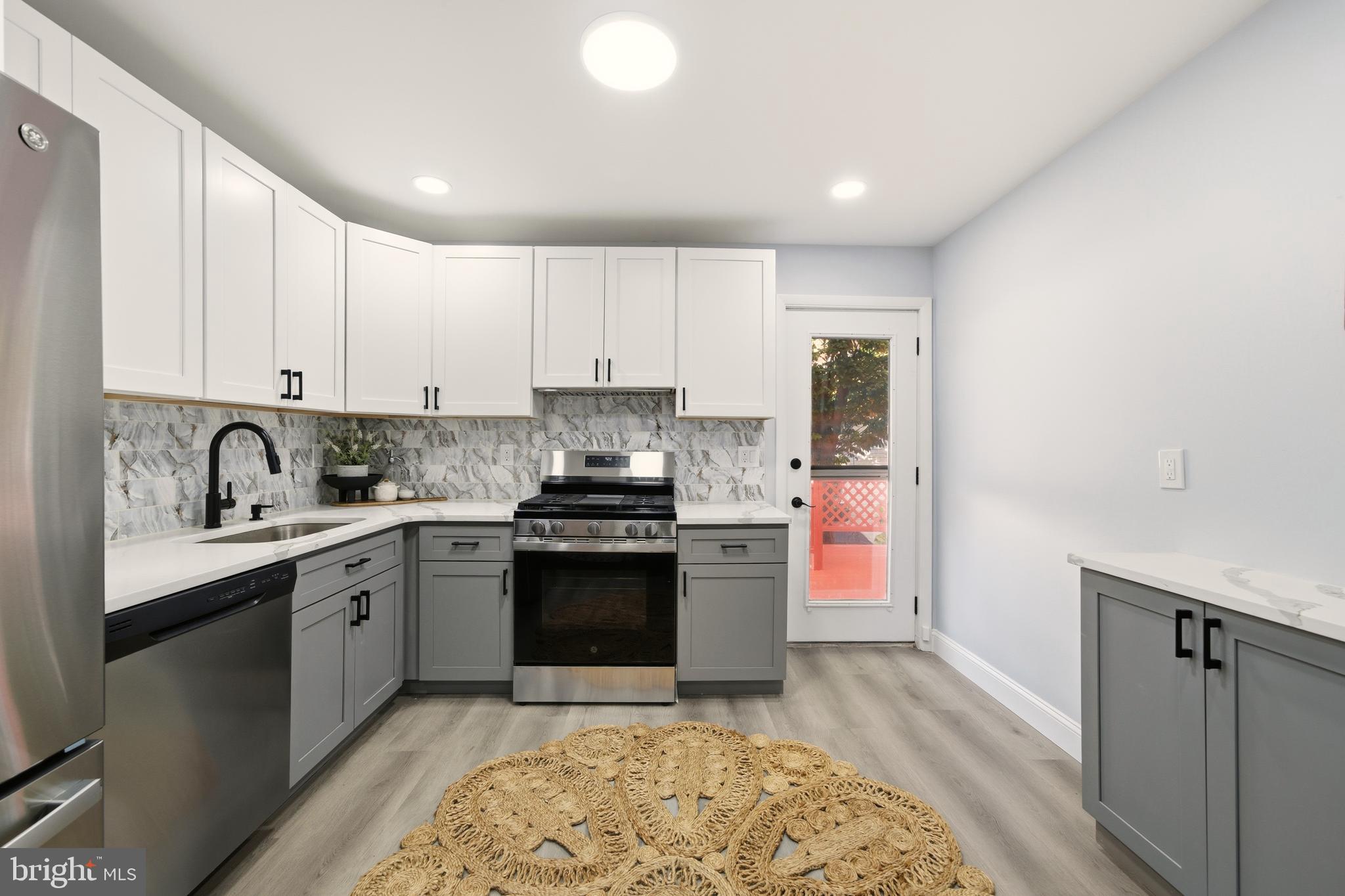 171 Juniper Road Havertown, PA 19083 - Photo 7 of 31 a kitchen with stainless steel appliances granite countertop a stove a sink and a refrigerator