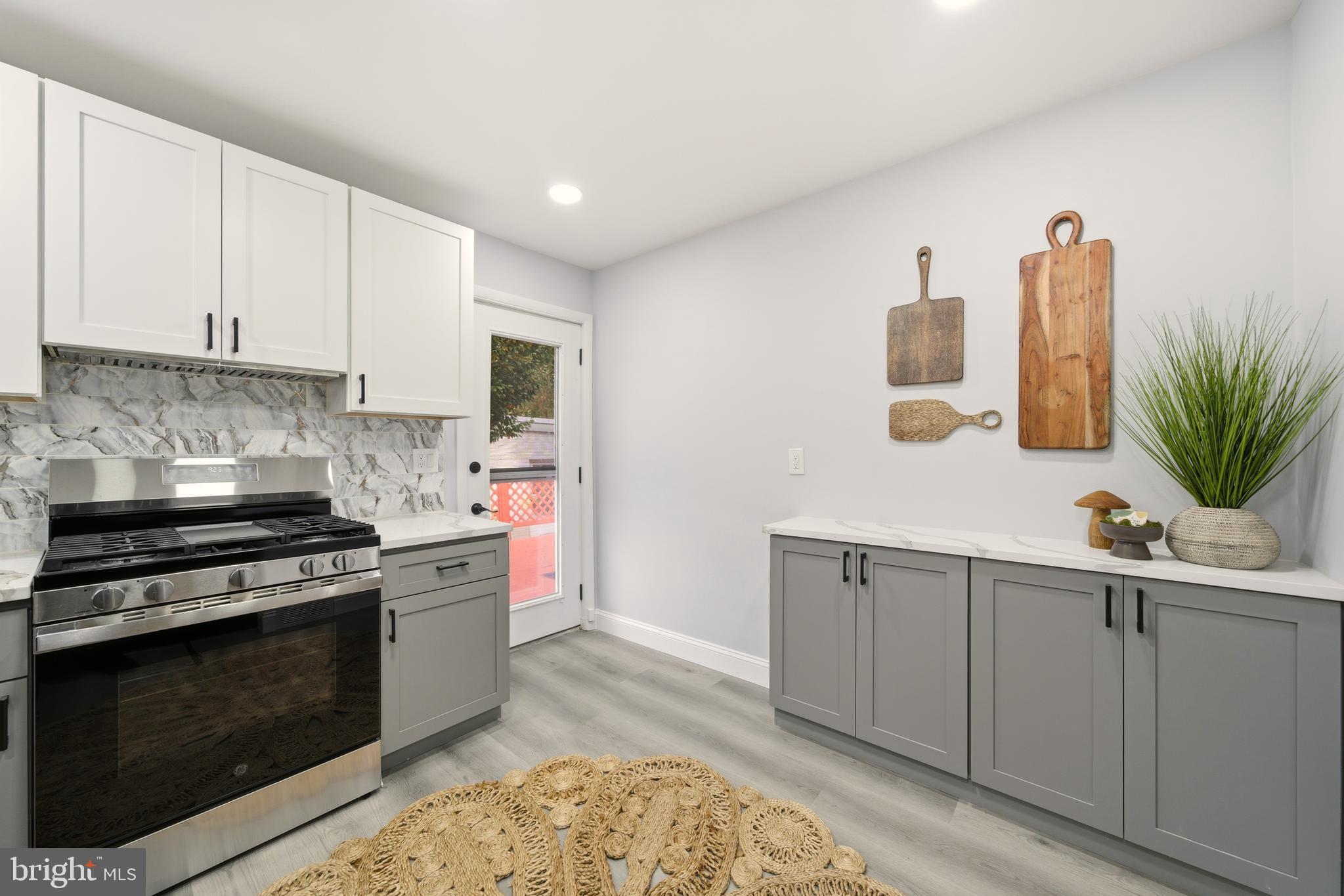 171 Juniper Road Havertown, PA 19083 - Photo 9 of 31 a kitchen with stainless steel appliances a stove a sink and a microwave