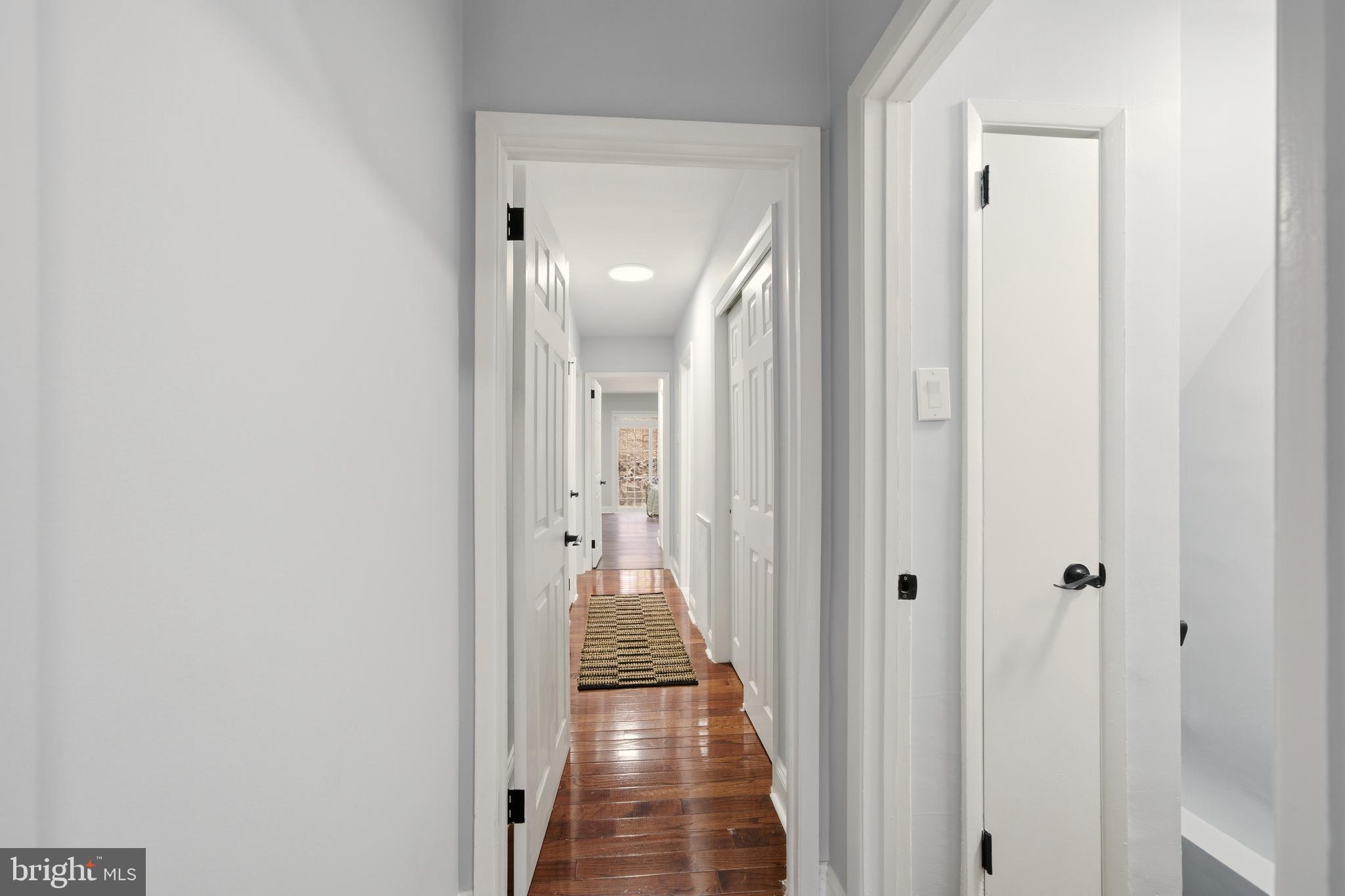 171 Juniper Road Havertown, PA 19083 - Photo 10 of 31 a view of a hallway with a wooden floor