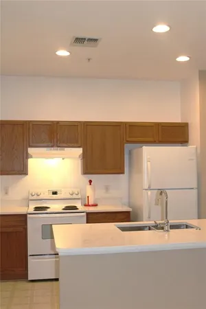 a view of a kitchen with a sink and cabinet area