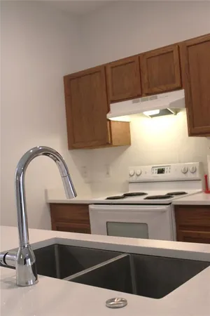 a close view of a sink and dishwasher
