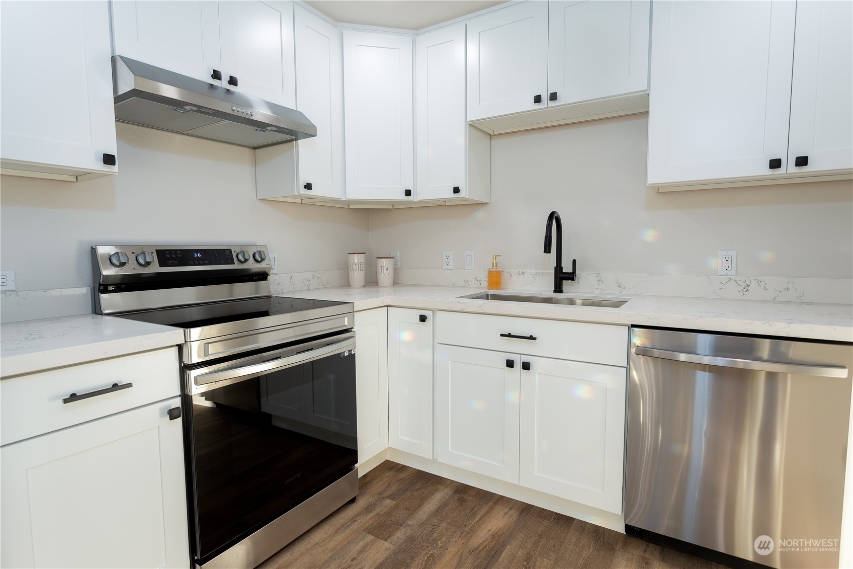 1272 South 315th Street Federal Way, WA 98003 - Photo 12 of 29 a kitchen with white cabinets and appliances