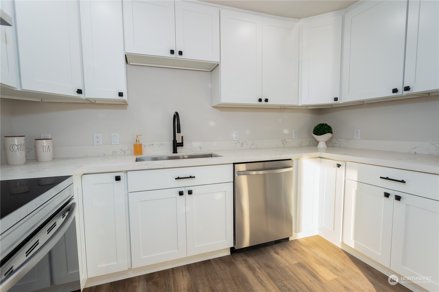 1272 South 315th Street Federal Way, WA 98003 - Photo 13 of 29 a kitchen with stainless steel appliances granite countertop white cabinets and a hard wood floors