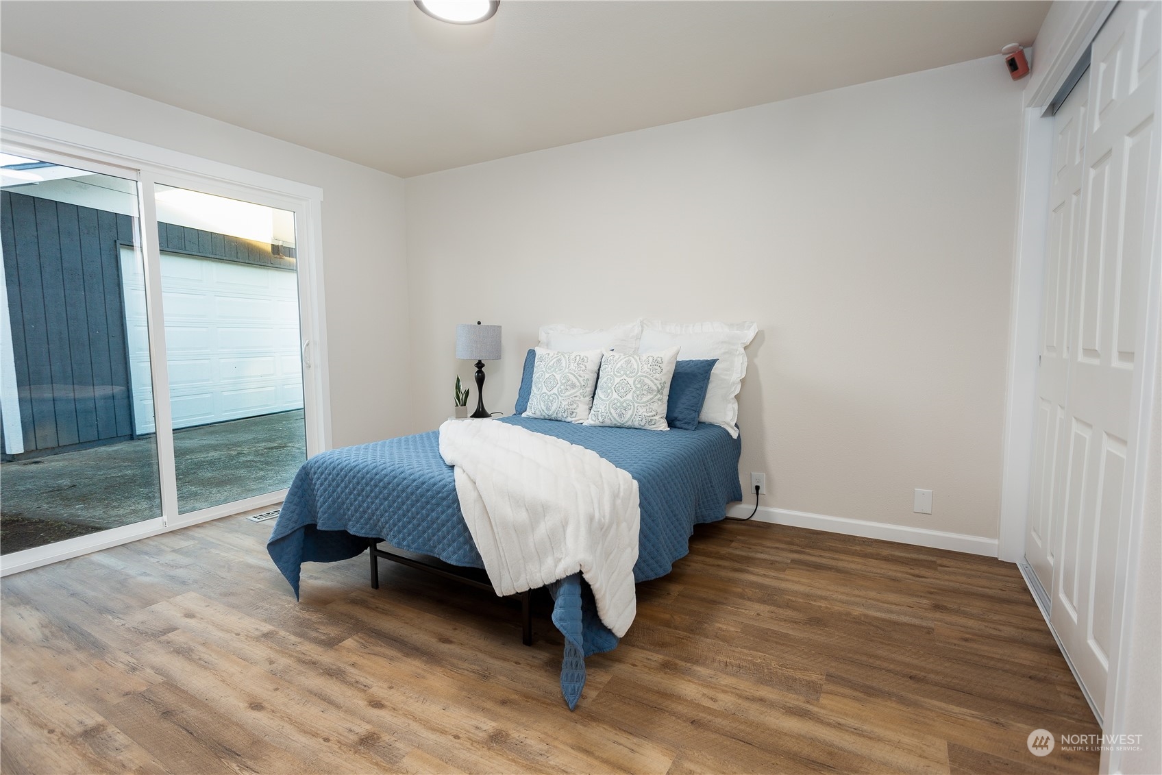 1272 South 315th Street Federal Way, WA 98003 - Photo 22 of 29 a bedroom with a bed and wooden floor