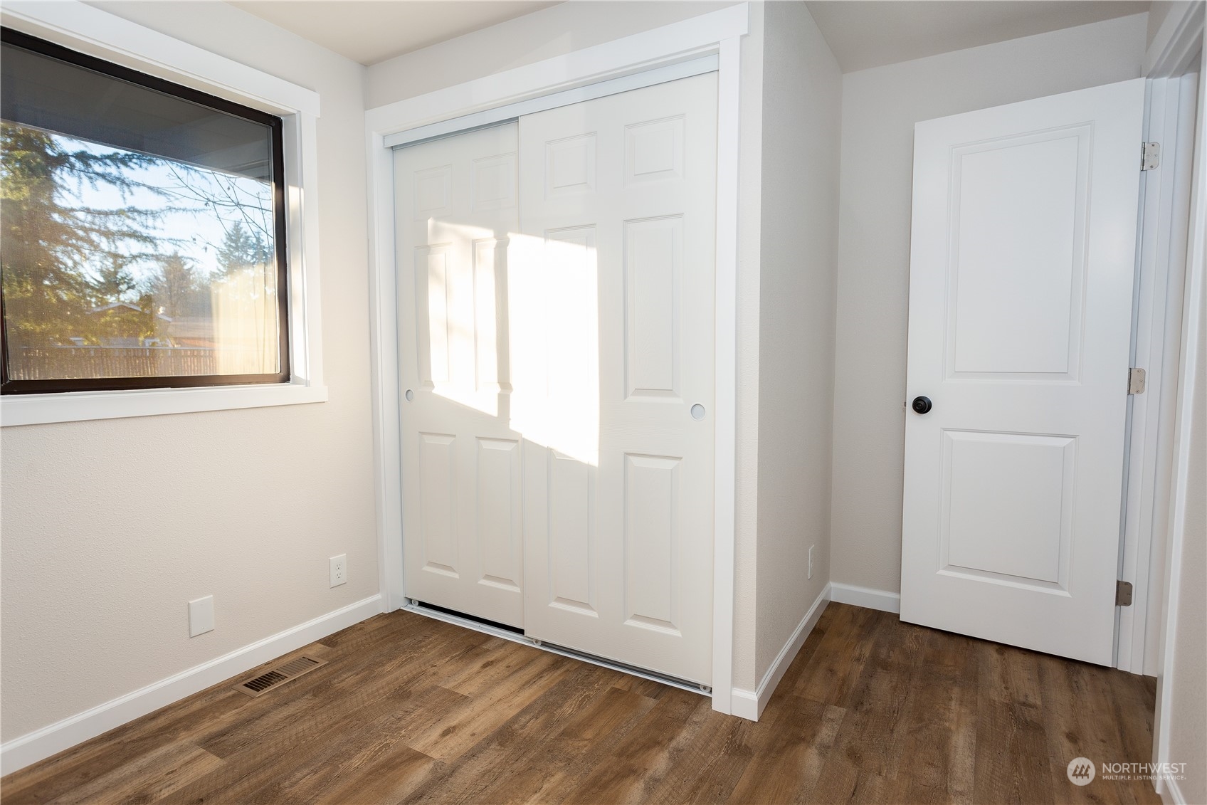 1272 South 315th Street Federal Way, WA 98003 - Photo 29 of 29 an empty room with wooden floor and windows
