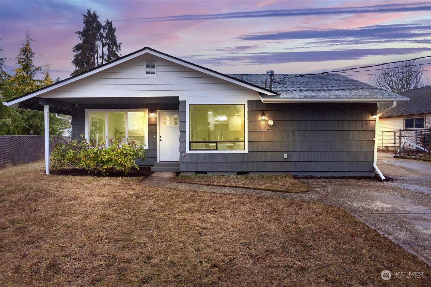 1272 South 315th Street Federal Way, WA 98003 - Photo 3 of 29 a front view of a house with a yard and garage