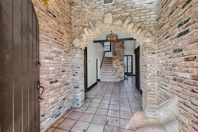 a view of a pathway door with wooden floor