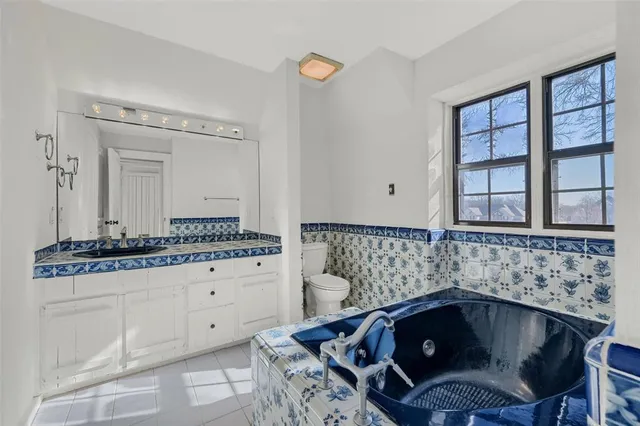 a bathroom with a bathtub and a sink
