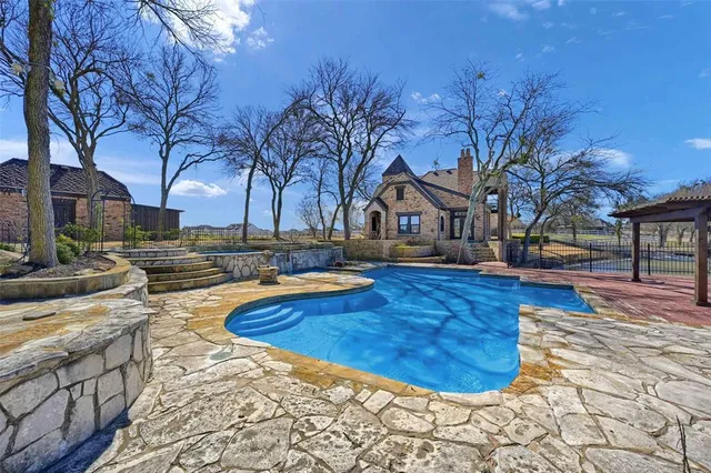 a view of a park with large trees