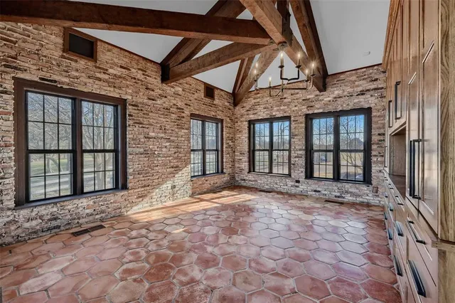 a view of a brick house with a large windows
