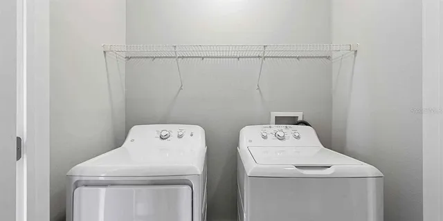 a utility room with dryer and washer