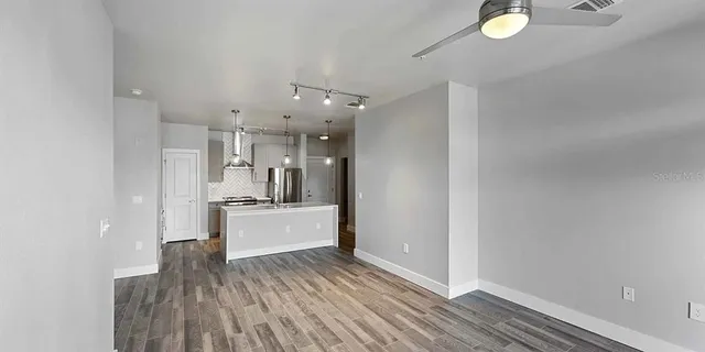 a view of a kitchen and stainless steel appliances