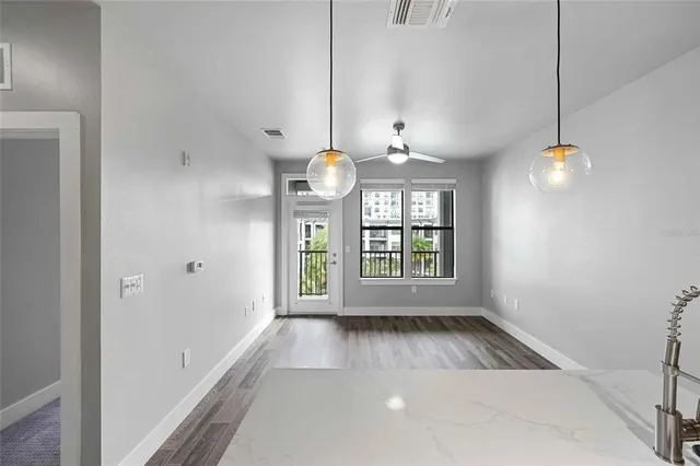 a view of an empty room with a window