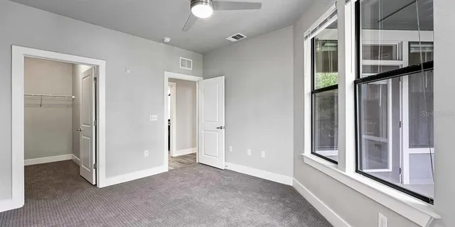 a view of a hallway with a living room
