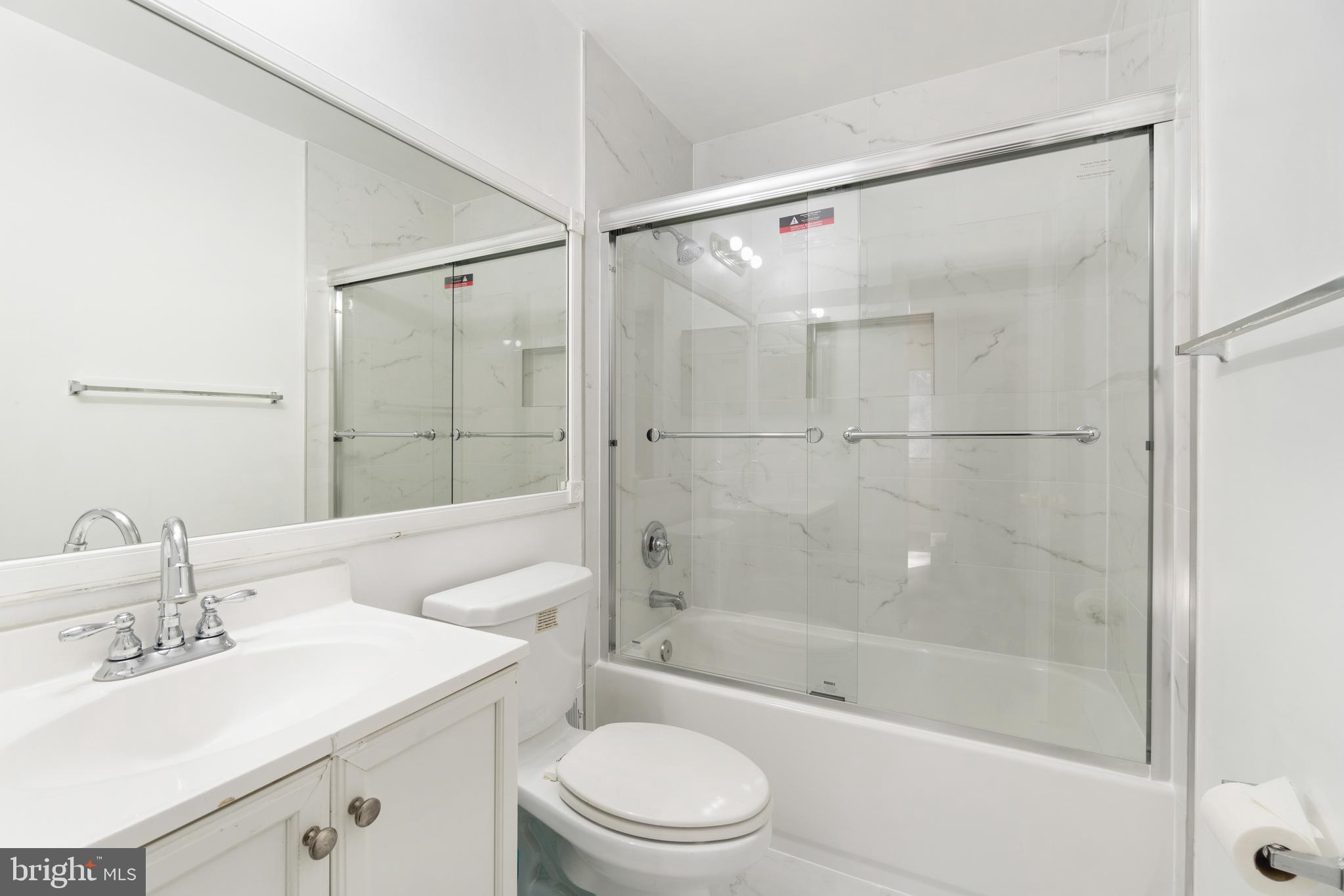 11924 Barrel Cooper Court Reston, VA 20191 - Photo 19 of 27 Recently updated hall bath, new shower tiling.