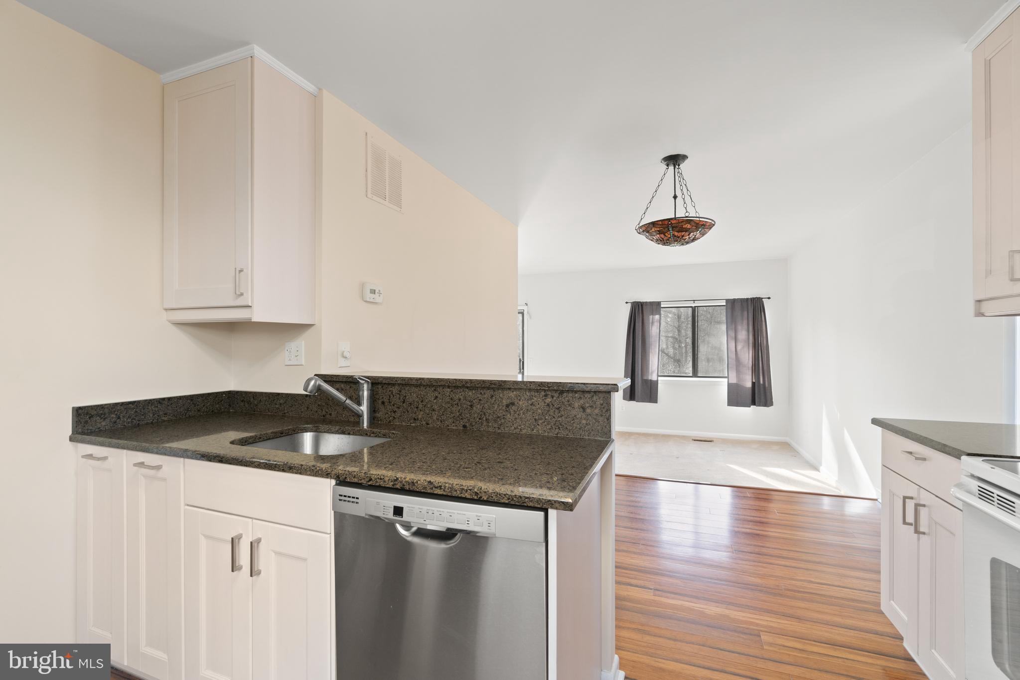 11924 Barrel Cooper Court Reston, VA 20191 - Photo 7 of 27 View of dining area and family room from kitchen.