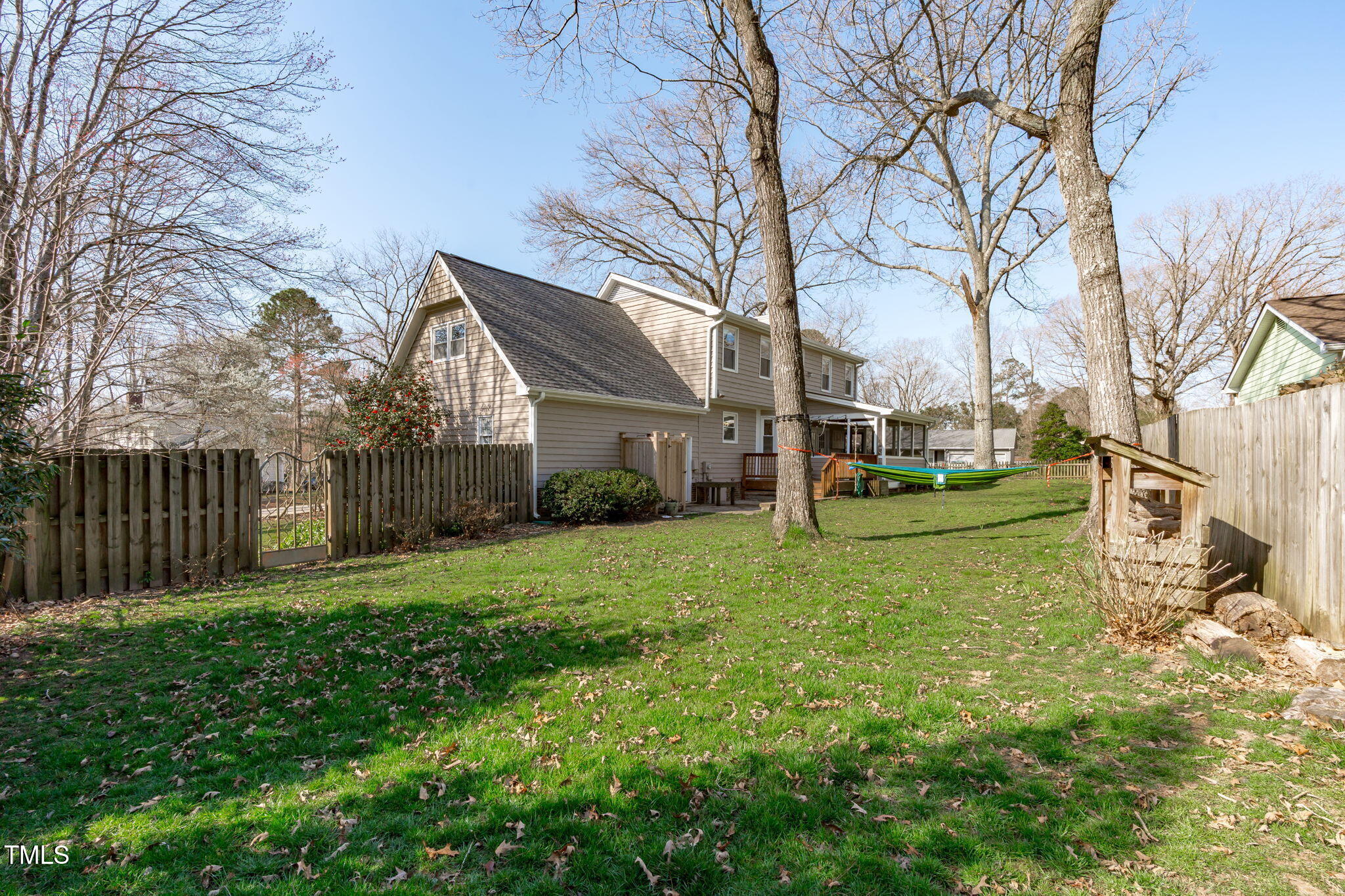 2828 Pidgeon Hill Road Raleigh, NC 27613 - Photo 29 of 38 a view of a house with backyard and trees