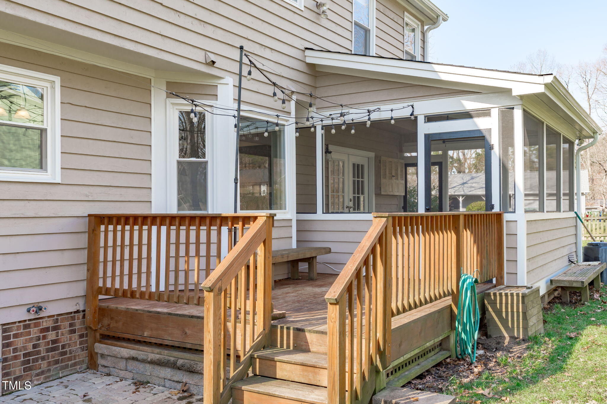 2828 Pidgeon Hill Road Raleigh, NC 27613 - Photo 32 of 38 a view of a brick house with a wooden deck