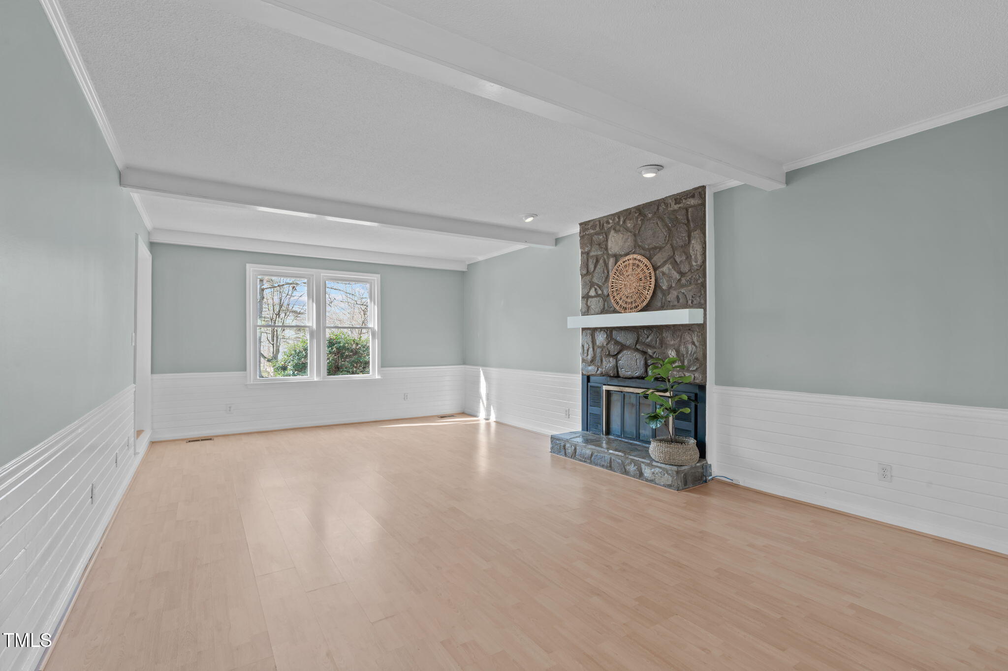 2828 Pidgeon Hill Road Raleigh, NC 27613 - Photo 5 of 38 wooden floor in an empty room with a window