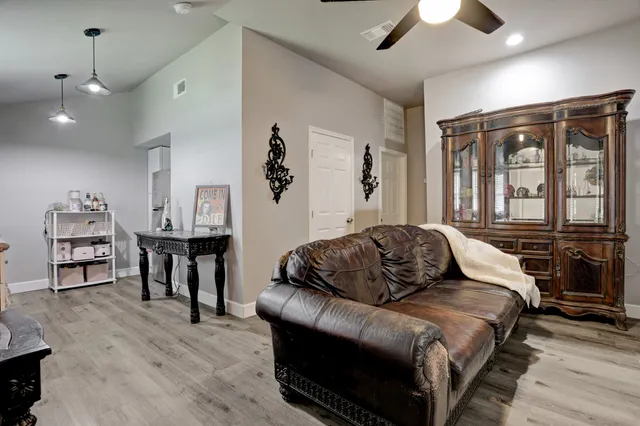 a bedroom with a bed window and a chair