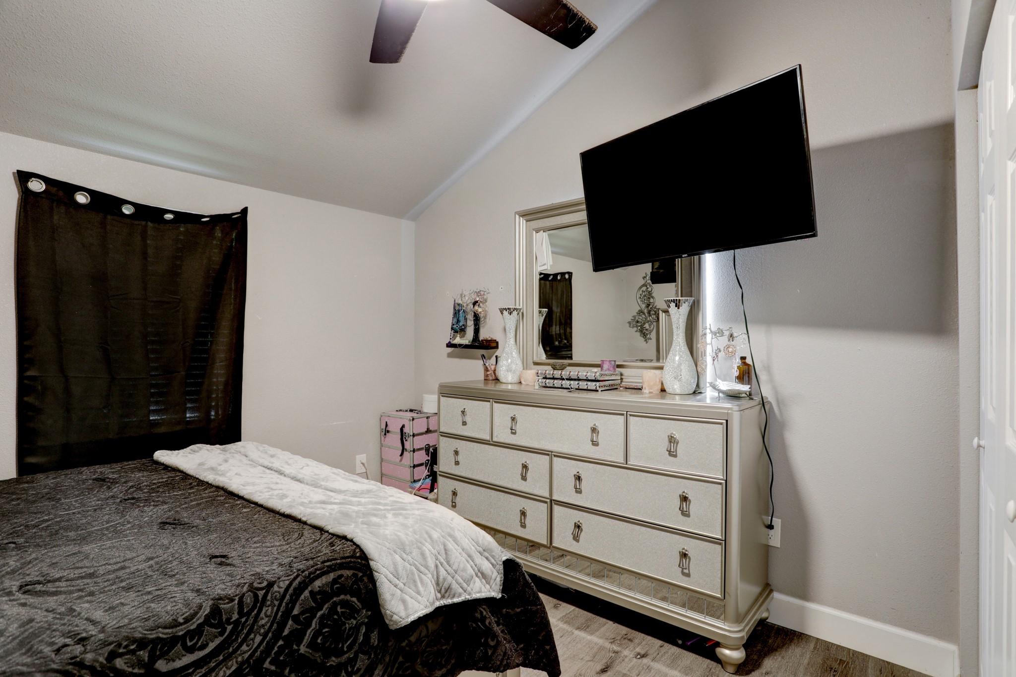 2322 Central Street Dickinson, TX 77539 - Photo 16 of 25 a bedroom with a bed and a flat tv screen on wall