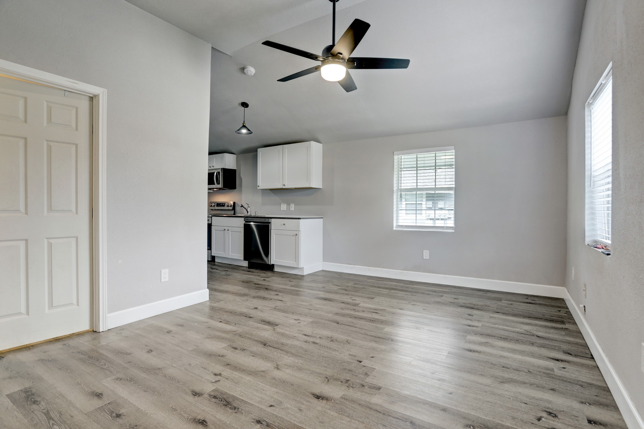 2322 Central Street Dickinson, TX 77539 - Photo 6 of 25 wooden floor in an empty room with a window
