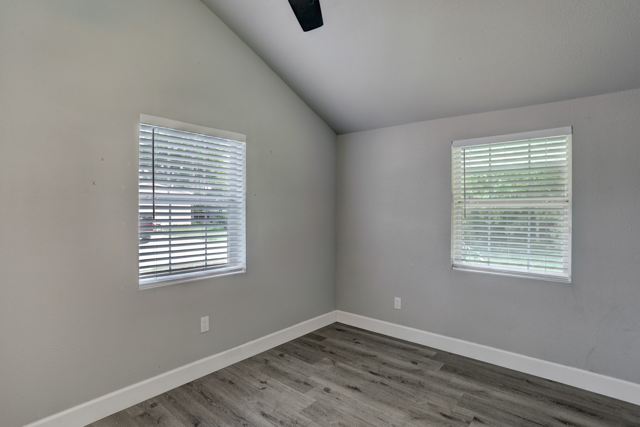 2322 Central Street Dickinson, TX 77539 - Photo 10 of 25 a view of an empty room with wooden floor and a window