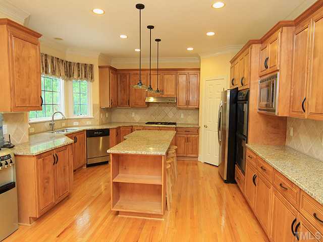 5201 Azure Lane Raleigh, NC 27613 - Photo 4 of 12 This kitchen is wonderful with beautiful custom cabinetry, new granite counters, stainless steel appliances, so much room to create those wonderful Gourmet meals, and conversation with family and friends...