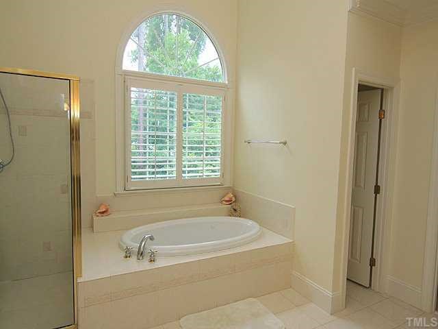 5201 Azure Lane Raleigh, NC 27613 - Photo 8 of 12 Enjoy this fabulous Master bath. Another private part of the world just for you to relax at day's end. Tile floors, tub surround Spa tub, sep shower, to make a statement of elegance, two lrg separate vanities are an added plus as well.