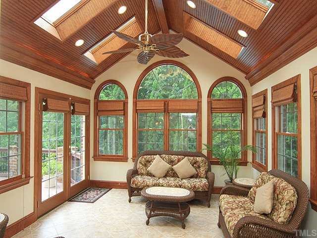 5201 Azure Lane Raleigh, NC 27613 - Photo 10 of 12 Love this tiled, all season heated and cooled sunroom with skylights and extensive wood molding off the kitchen, use as a breakfast room, keeping room or just relax and enjoy the incredible views of your pool through great windows.