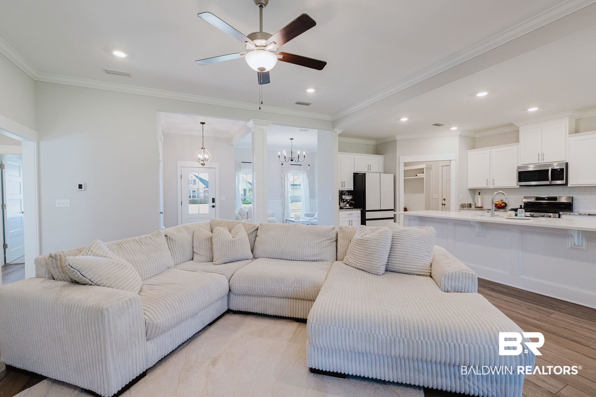 7872 Calverton Street Foley, AL 36535 - Photo 32 of 76 Spacious open-concept living area featuring wood-finish flooring, a ceiling fan with integrated lighting, and recessed lighting