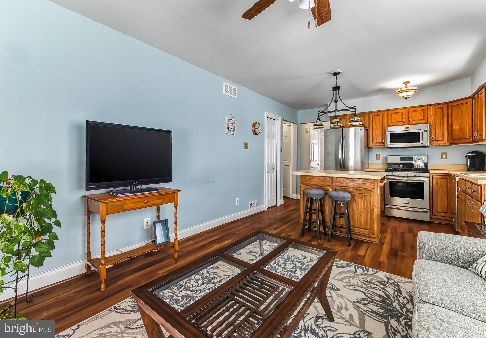 241 Gaunt Drive Mickleton, NJ 08056 - Photo 11 of 32 a living room with furniture and a flat screen tv