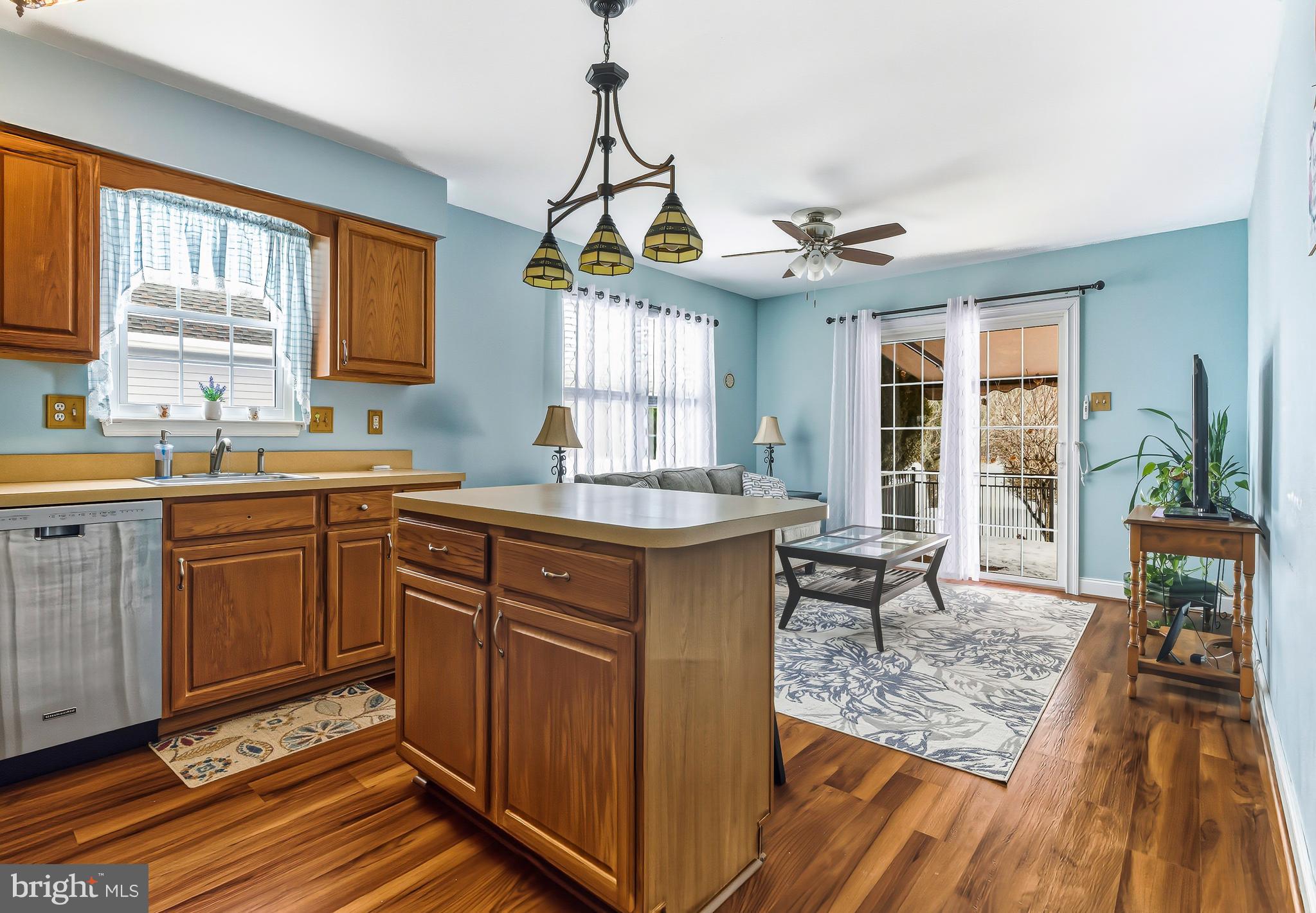 241 Gaunt Drive Mickleton, NJ 08056 - Photo 12 of 32 a kitchen with sink cabinets and wooden floor