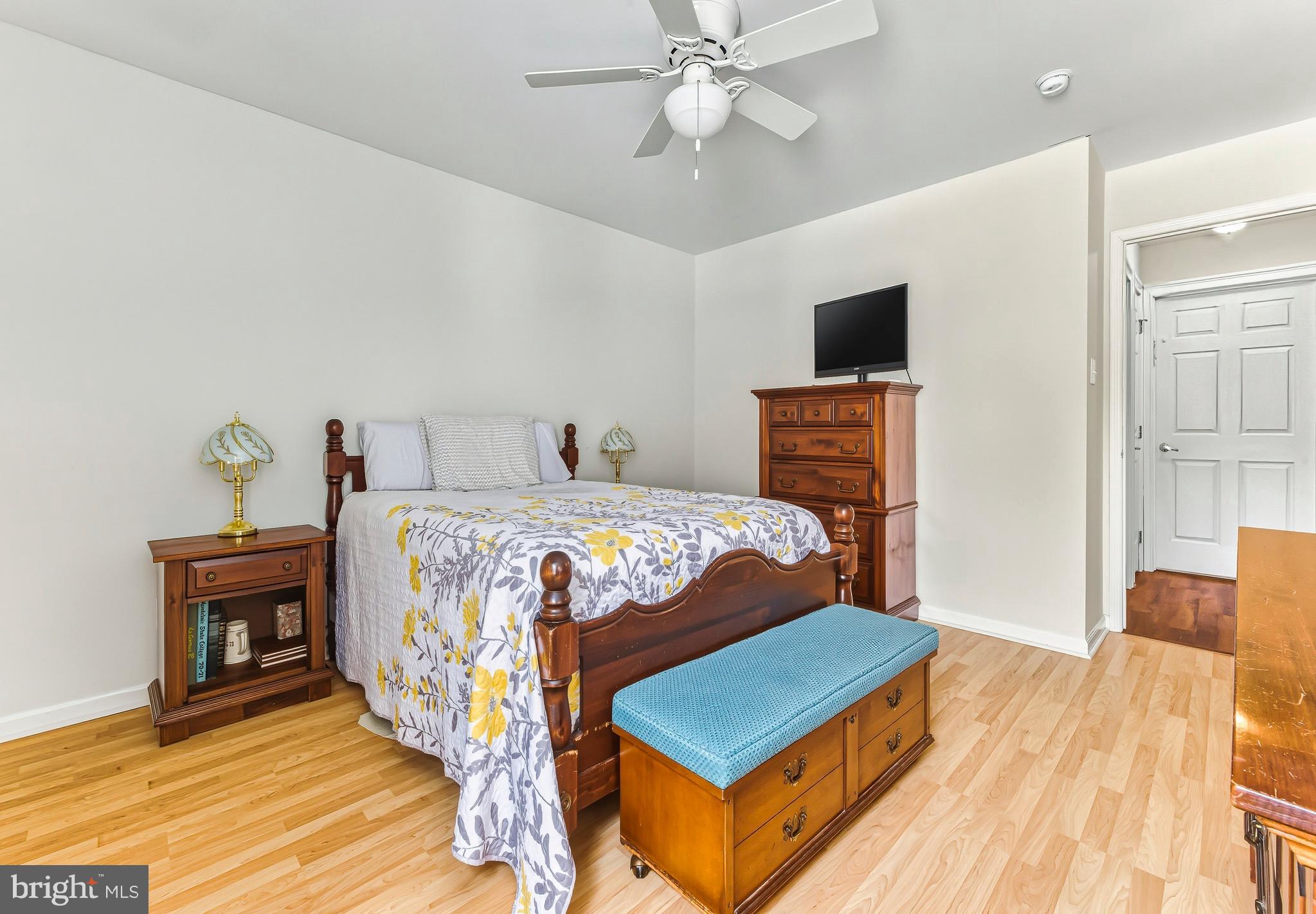241 Gaunt Drive Mickleton, NJ 08056 - Photo 16 of 32 a bedroom with a bed and wooden floor