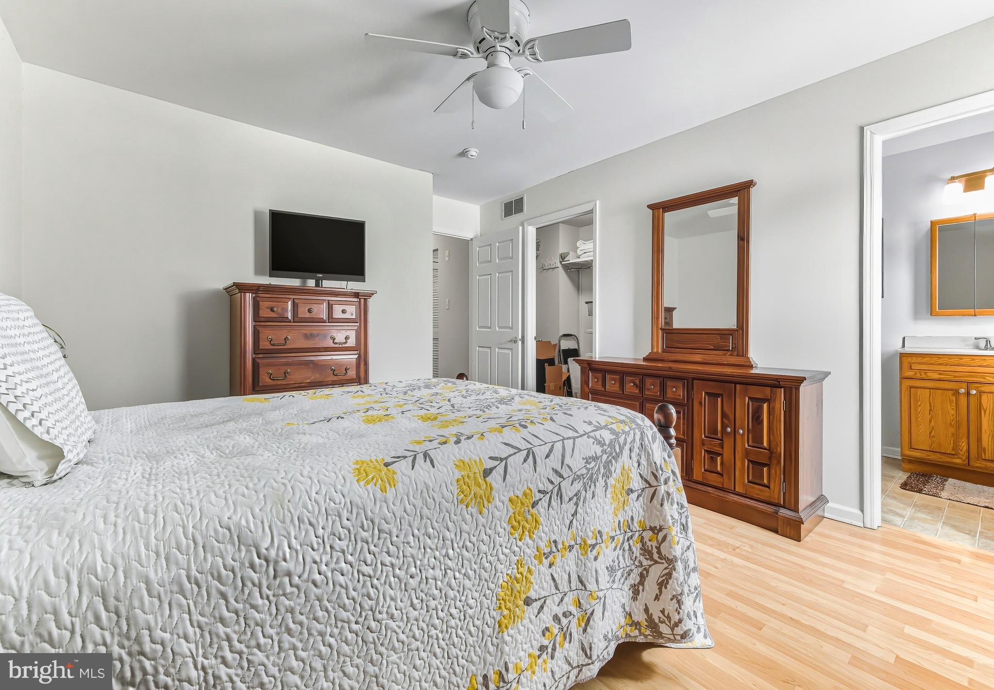241 Gaunt Drive Mickleton, NJ 08056 - Photo 17 of 32 a bedroom with a bed and a flat screen tv