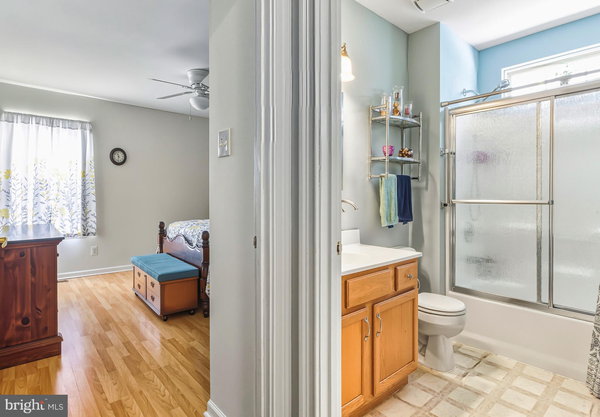 241 Gaunt Drive Mickleton, NJ 08056 - Photo 19 of 32 a en suite bathroom with a granite countertop toilet and a shower