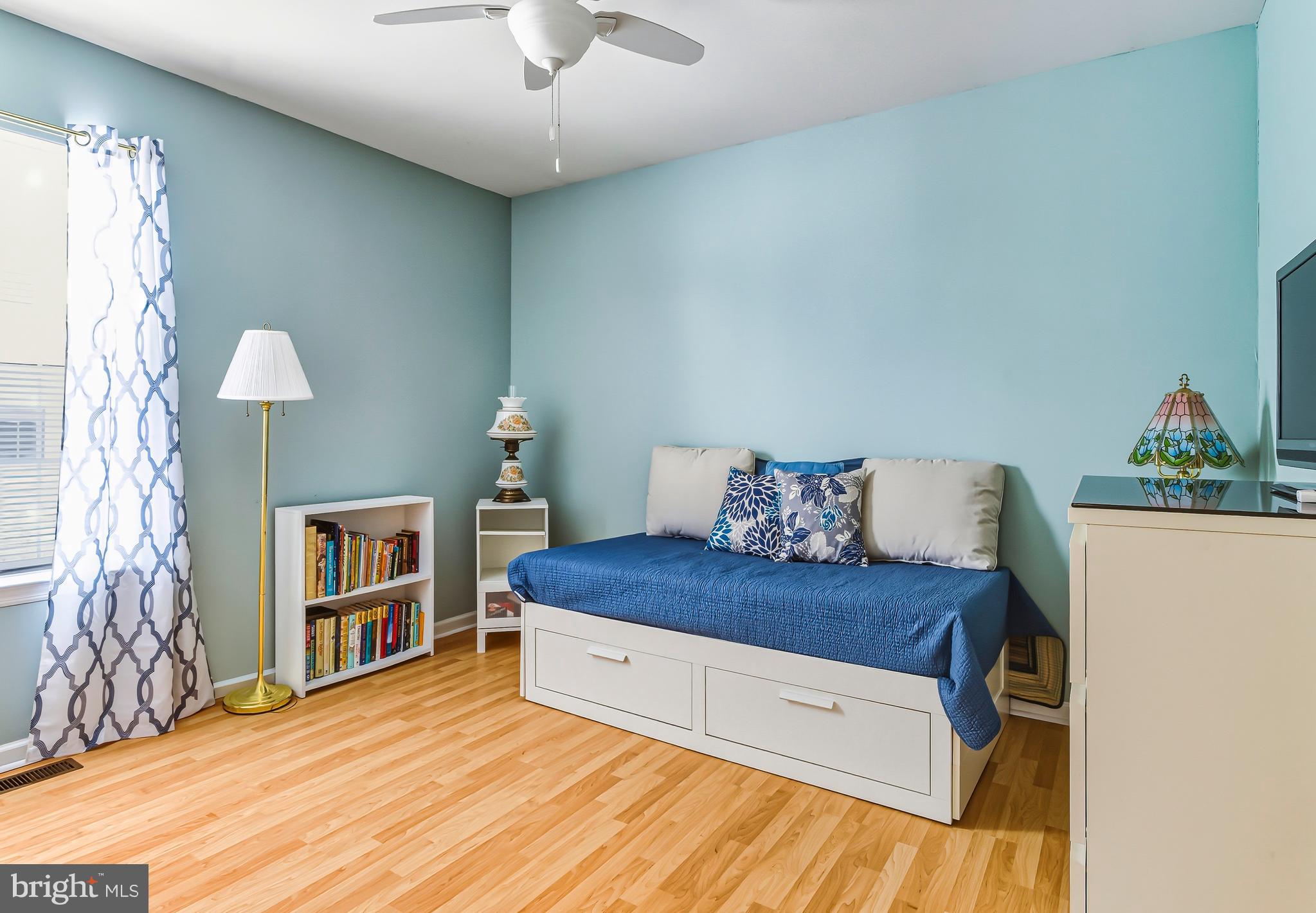 241 Gaunt Drive Mickleton, NJ 08056 - Photo 20 of 32 a living room with a bed and a chandelier