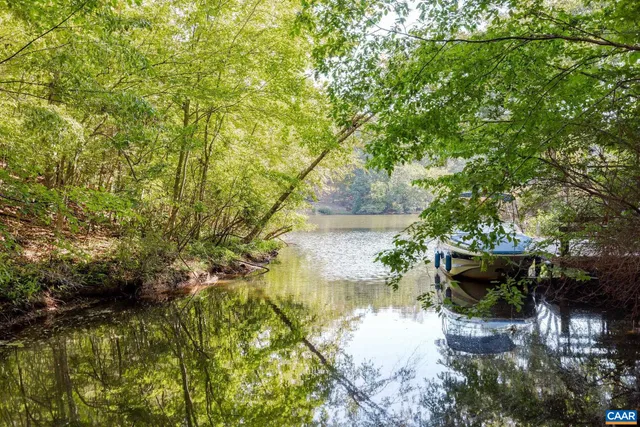 a view of a lake with green space