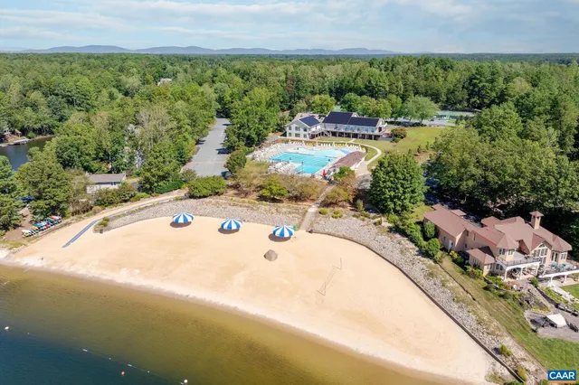 an aerial view of a house with a lake view and lake view