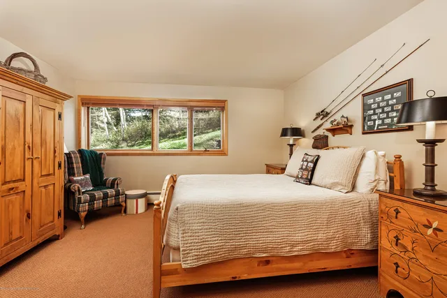 a spacious bathroom with a sink a toilet and shower