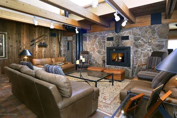a outdoor living space with patio furniture and a fireplace