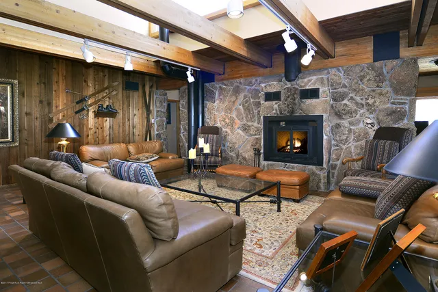 a outdoor living space with patio furniture and a fireplace