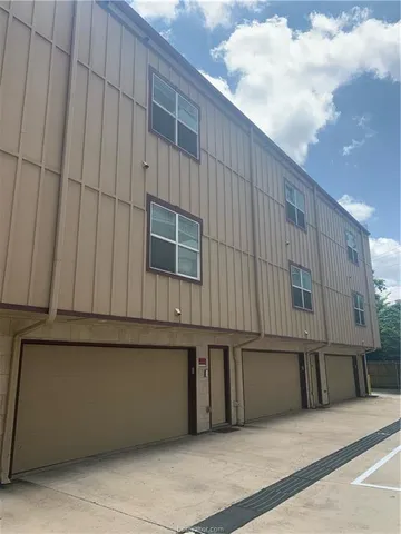 a living room with furniture a dining table and kitchen view