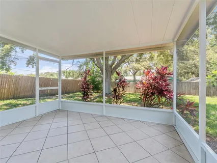 wooden floor in an empty room with glass windows