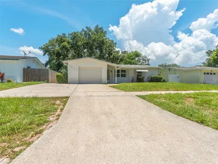 a view of house with a garden